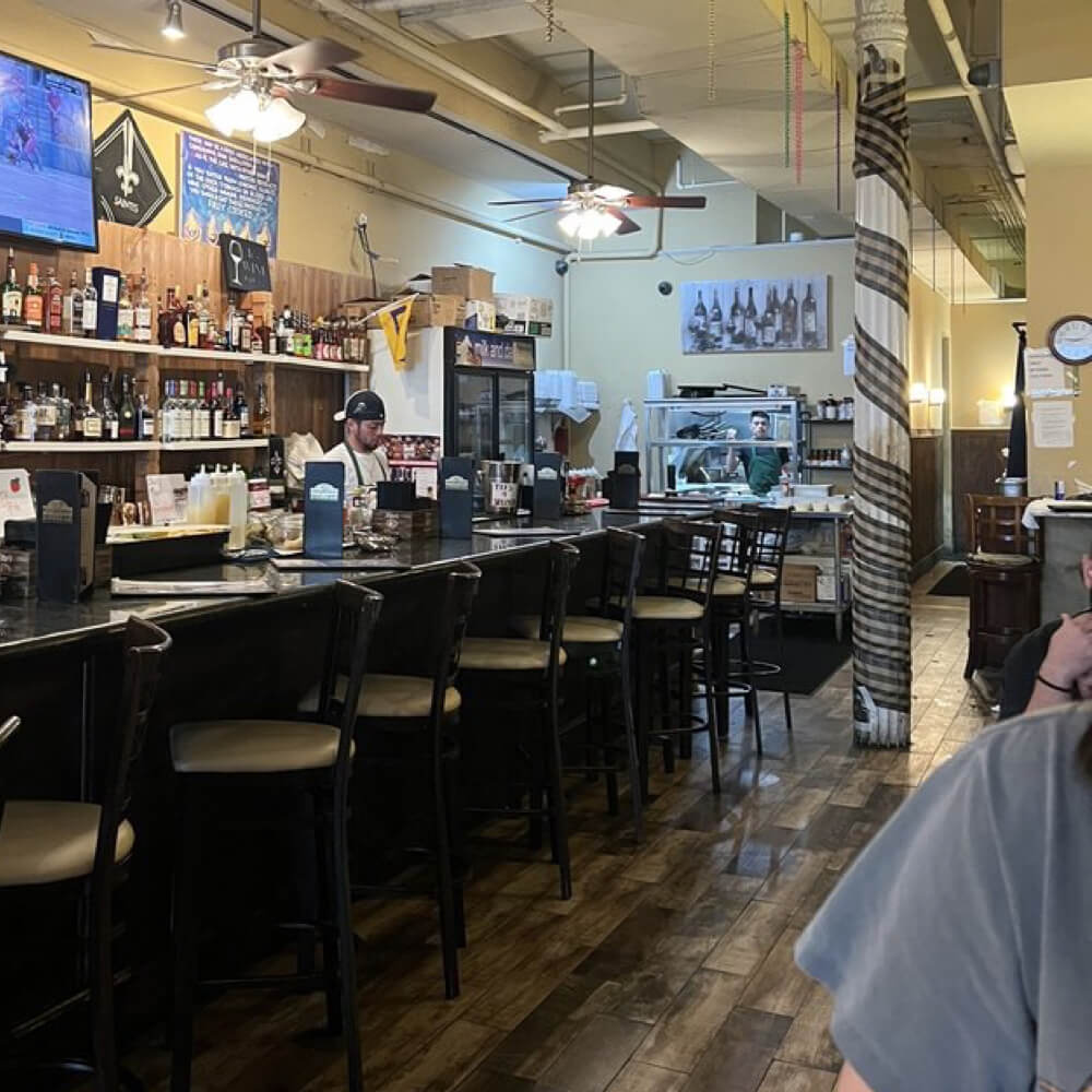 Friends enjoying a relaxed dinner at a New Orleans restaurant