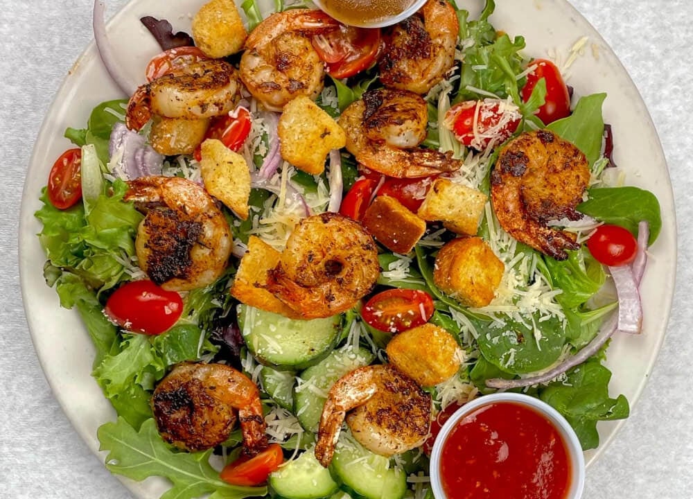 Cajun shrimp stew served hot with Southern spices, a Louisiana brunch favorite
