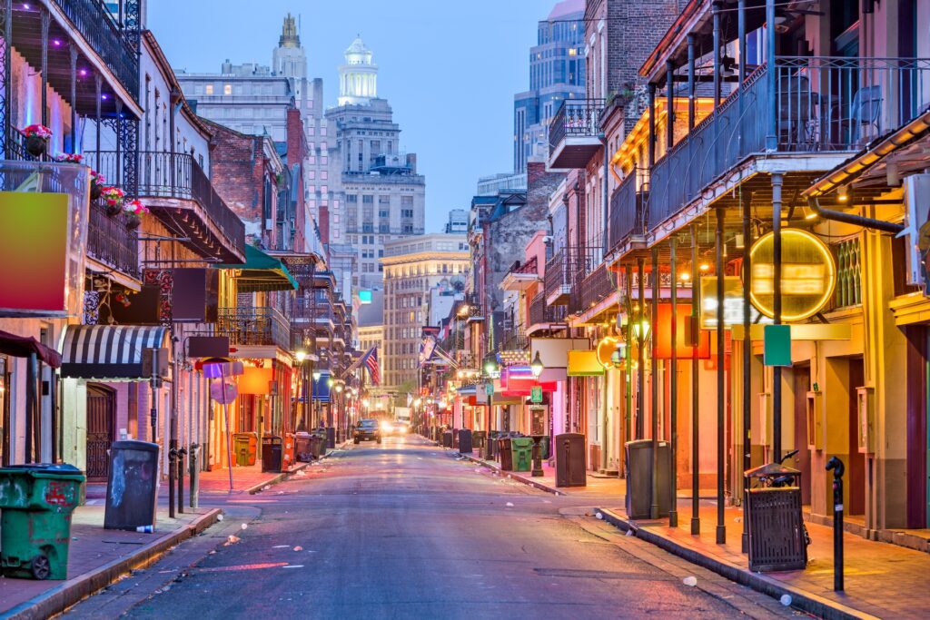 Perfect Day in New Orleans: Start Your Morning at Gallier’s 2 Night view of Bourbon Street with vibrant neon lights