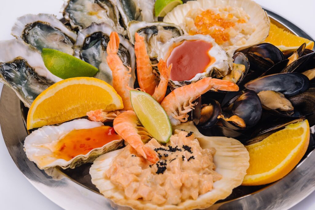 Seafood platter with oysters, shrimp, mussels, and citrus at a New Orleans restaurant