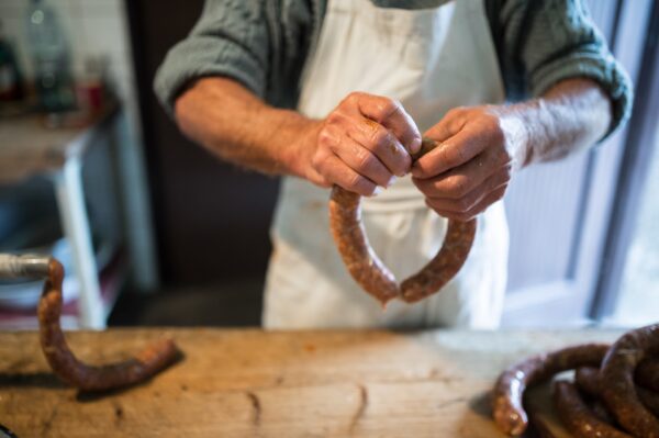 unrecognizable man making sausages the traditional 2024 10 18 09 23 06 utc - Authentic Louisiana, Boudin, Cajun Sausage, Creole Food, Gulf Coast Delicacies, Louisiana Cuisine, New Orleans Food, Rice Sausage, Southern Dishes