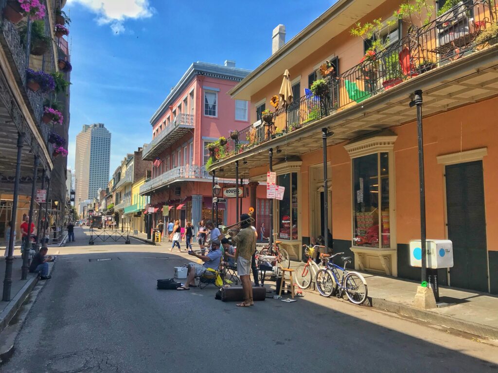Street performers playing music on a sunny day in the French Quarter, New Orleans