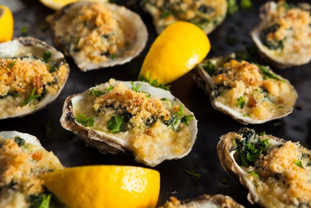 Baked oysters Rockefeller topped with breadcrumbs and herbs