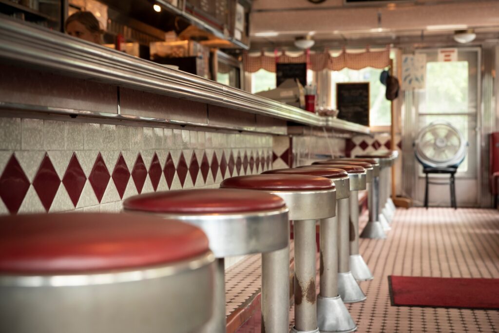 The History of Oyster Bars in New Orleans 2 Vintage-style oyster bar interior with counter seating in New Orleans