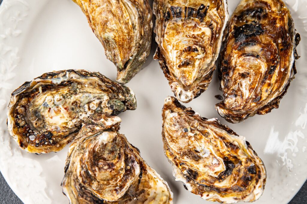 Charbroiled oysters cooked in the shell with butter and seasoning, New Orleans style