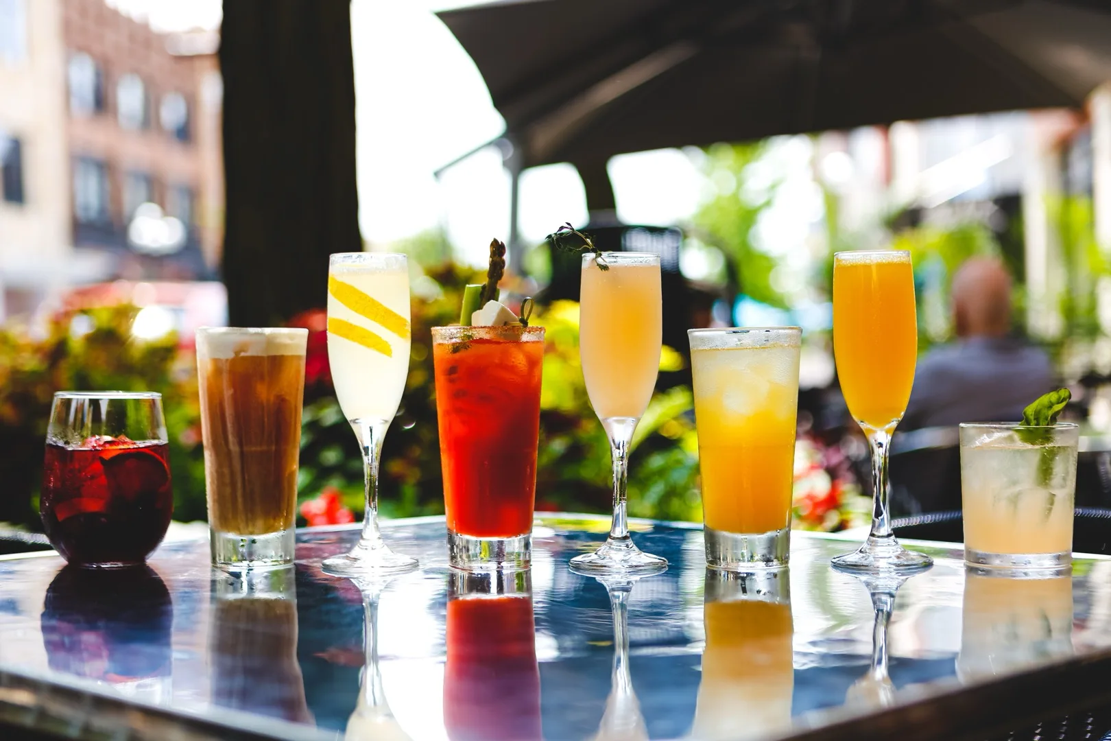 Lineup of classic New Orleans cocktails including Hurricane, Ramos Gin Fizz, and French 75